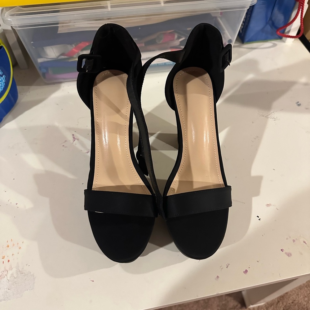 Black high heels. Never been worn.